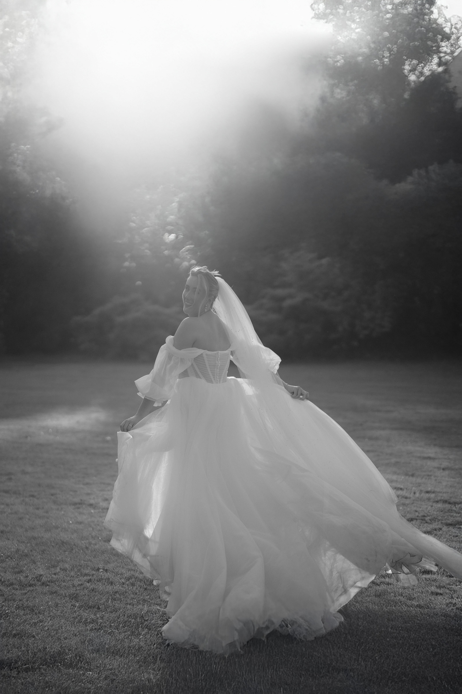 bride running away from camera on a summers evening at tipis at whatton house